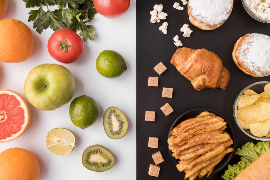 top-view-fruits-vegetables-versus-unhealthy-food