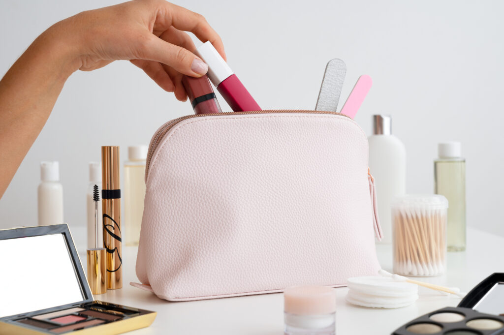 side-view-hands-holding-makeup-products