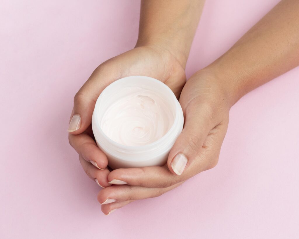 woman-holding-face-cream-box